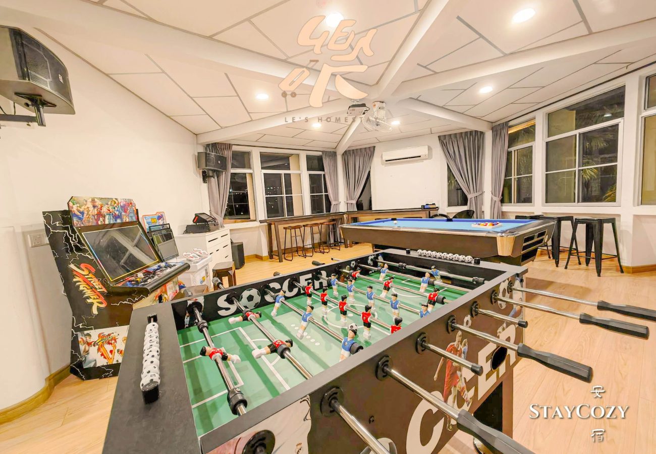 Entertainment hall featuring foosball table and arcade games at Le's Homestay Lot 550, a fun Homestay Melaka Private Pool unit