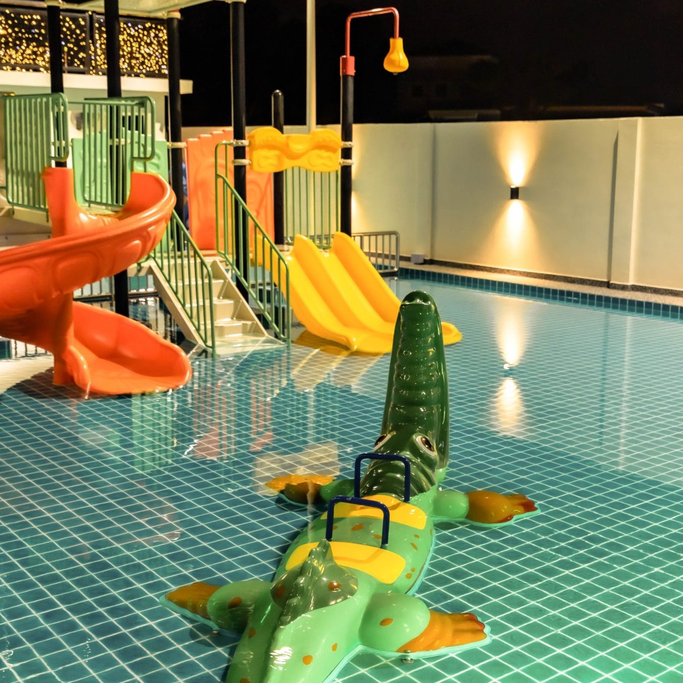 Private swimming pool with mini water park slide for kids at Le's Homestay