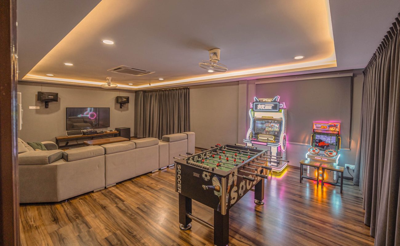 Foosball table soccer game and arcade machines entertainment zone at Le's Homestay Lot 916