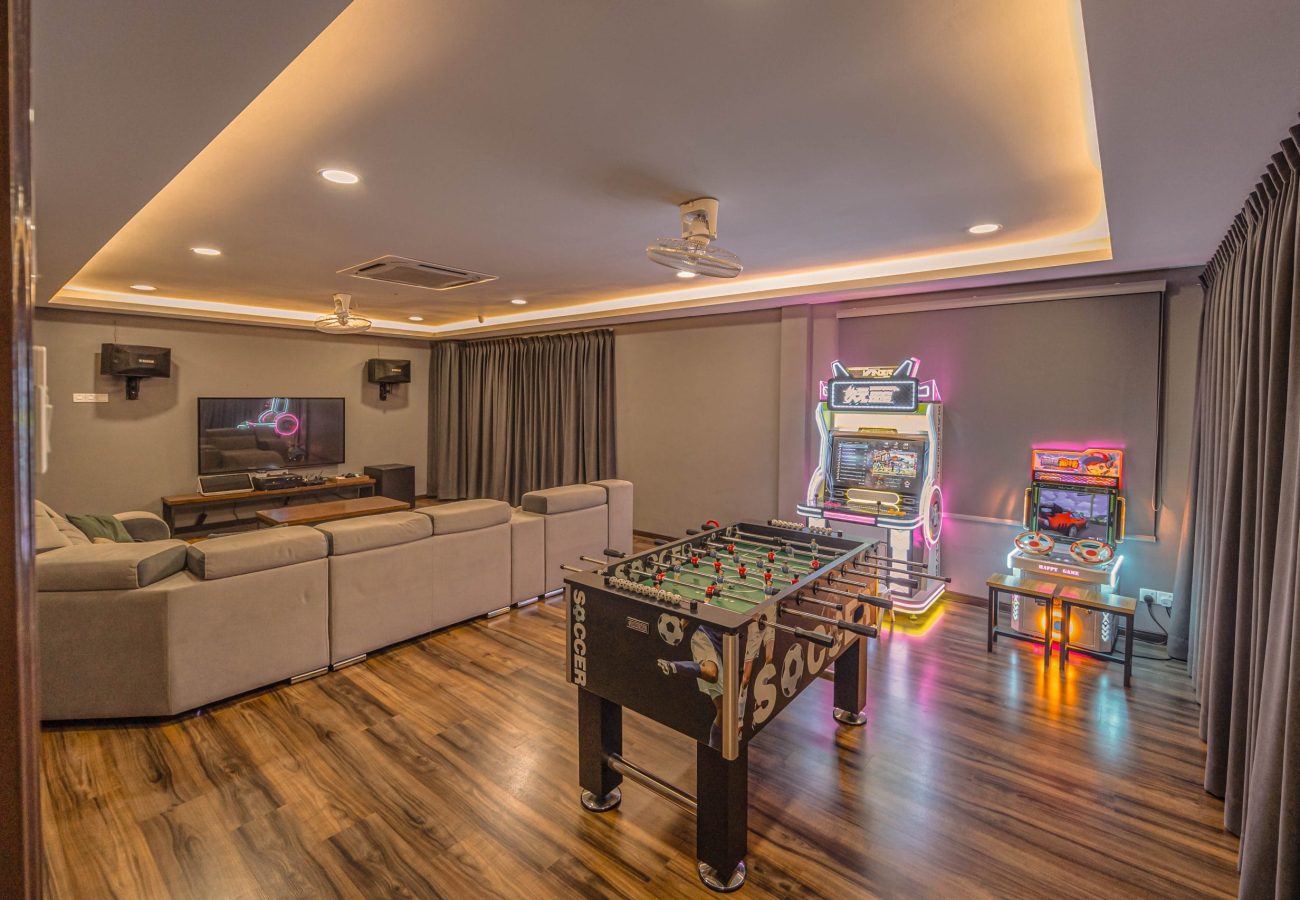 Foosball table soccer game and arcade machines entertainment zone at Le's Homestay Lot 916