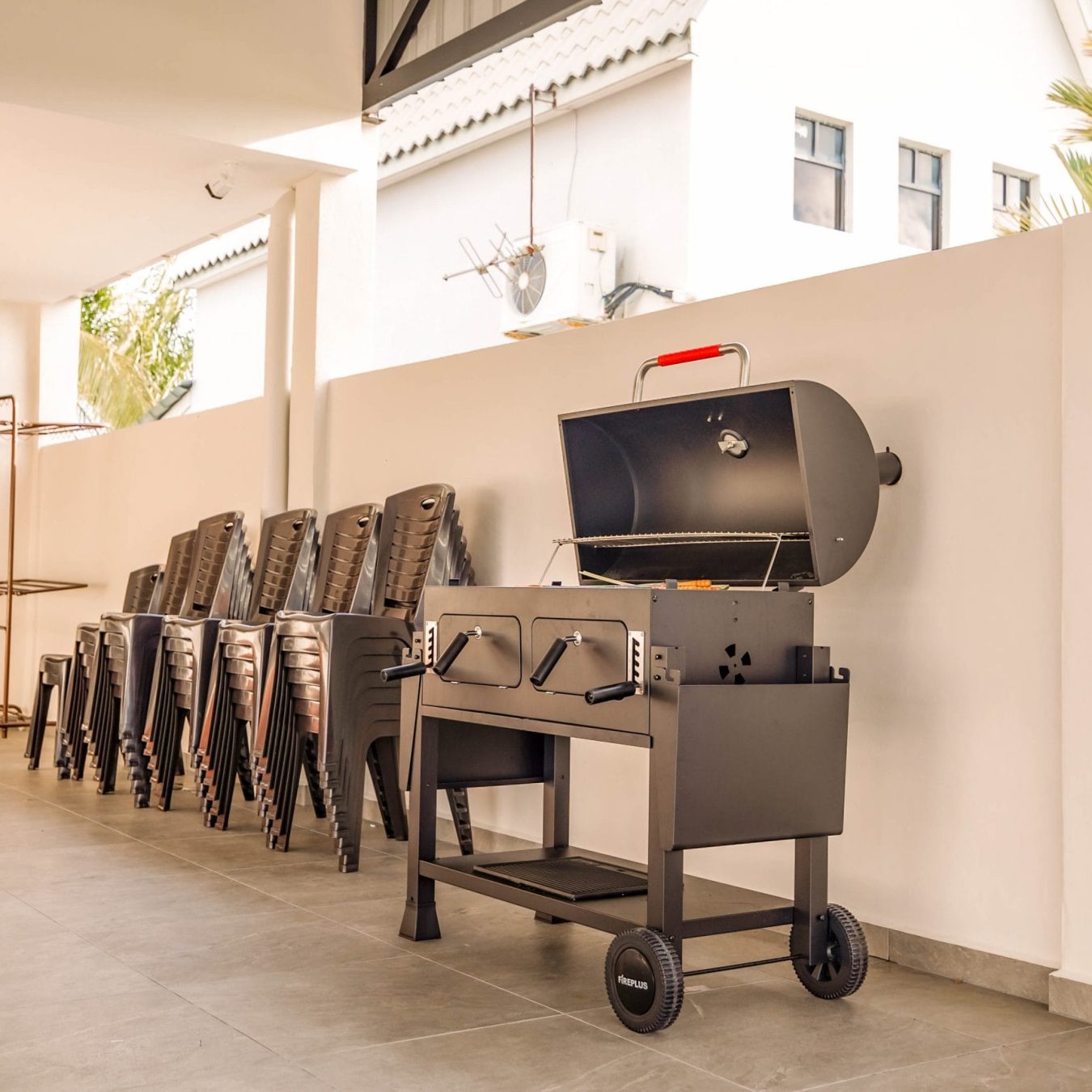 Outdoor BBQ area with event chairs provided at Le's Homestay Melaka