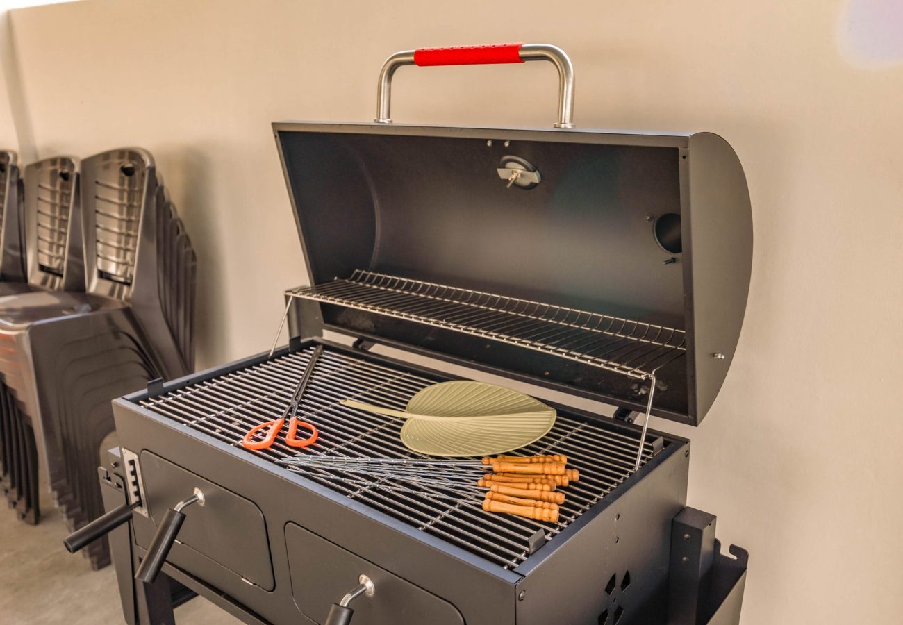 Large outdoor BBQ pit and grilling equipment provided at Le's Homestay A'Famosa Homestay