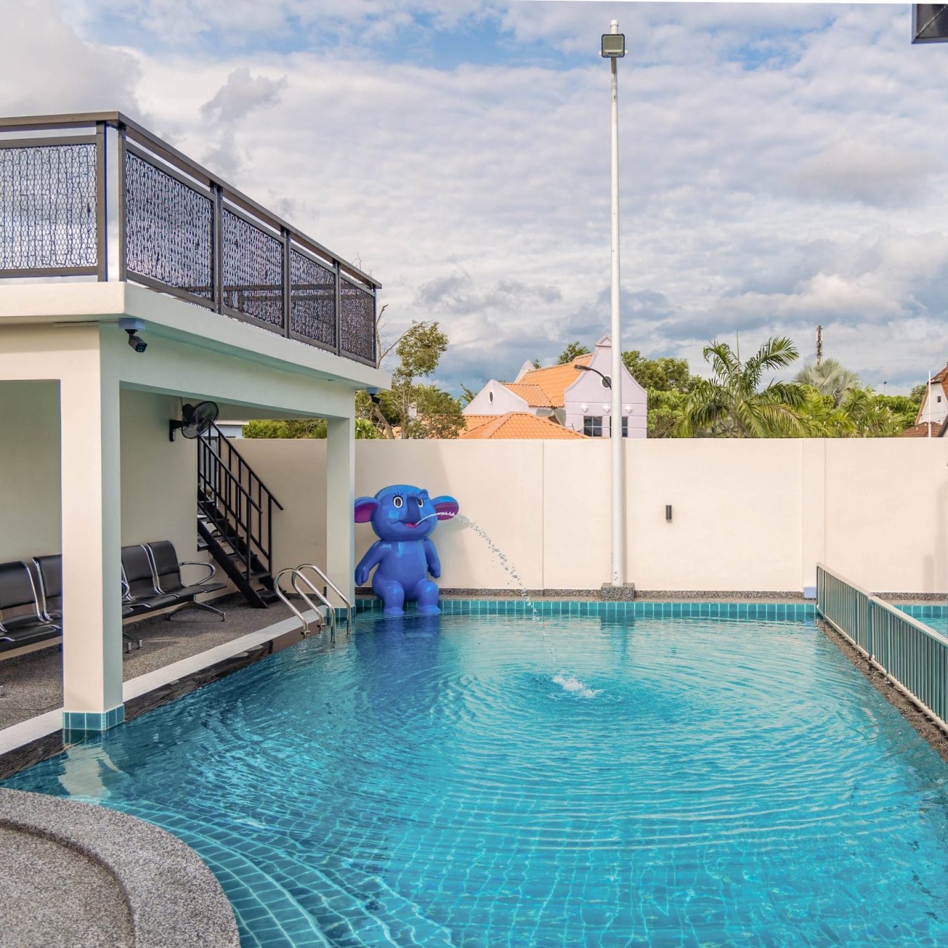 Private swimming pool with water features for family fun at Le's Homestay