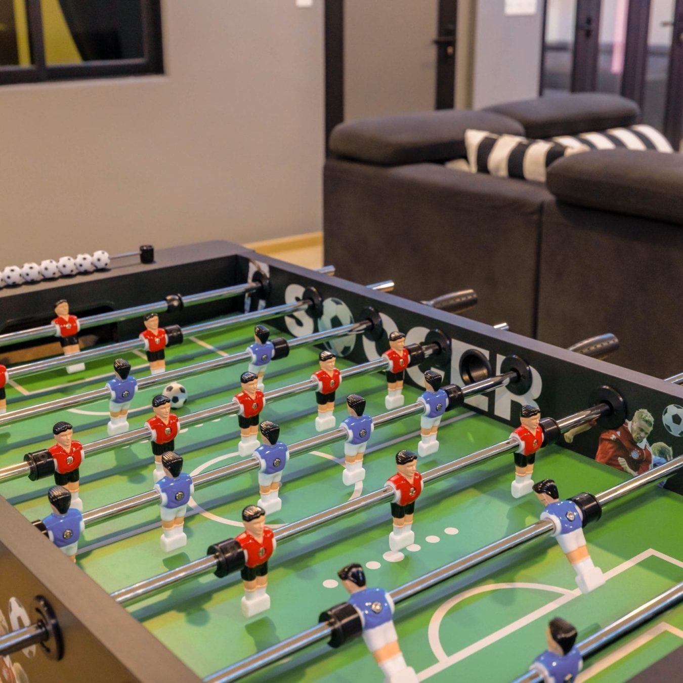 Foosball table game amenity for group activities at Le's Homestay