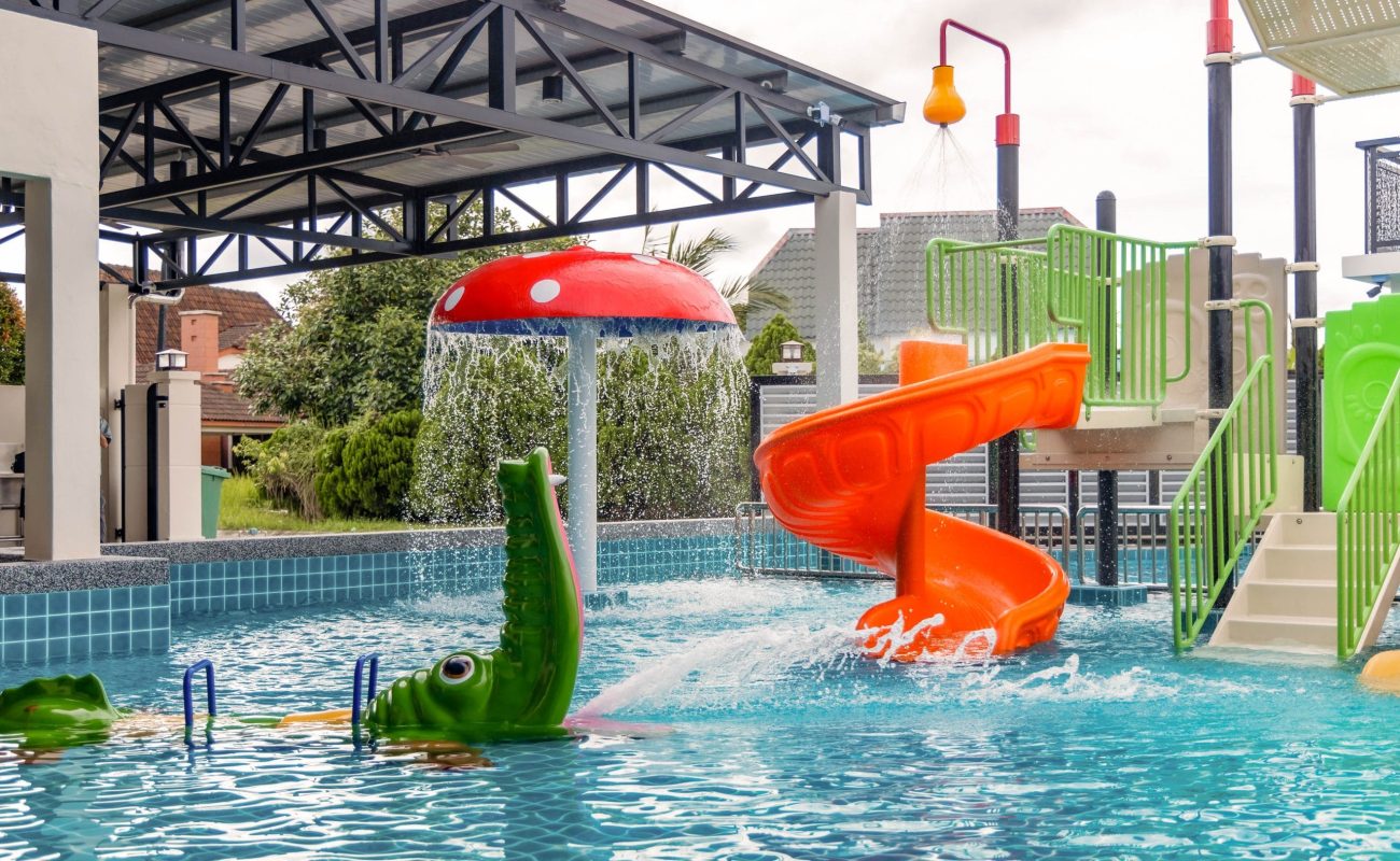 Kids mini water park pool with mushroom slide and crocodile float at Le's Homestay A'Famosa Homestay