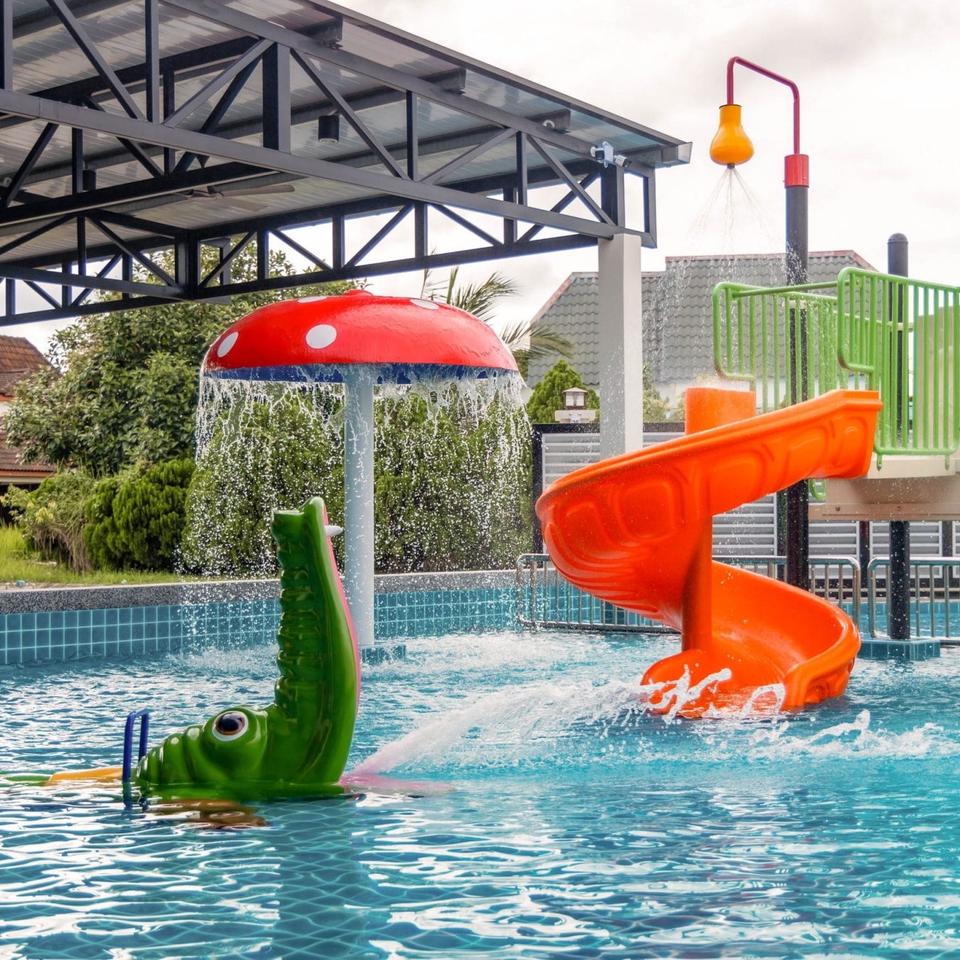Kids mini water park pool with mushroom slide and crocodile float at Le's Homestay A'Famosa Homestay