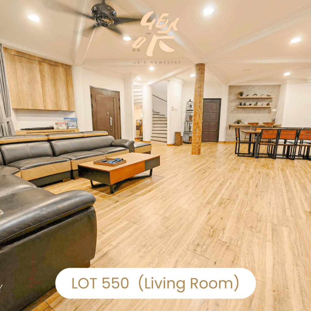 Comfortable L-shaped leather sofa in living room at Le's Homestay Lot 550, a cozy Homestay Melaka Private Pool unit.