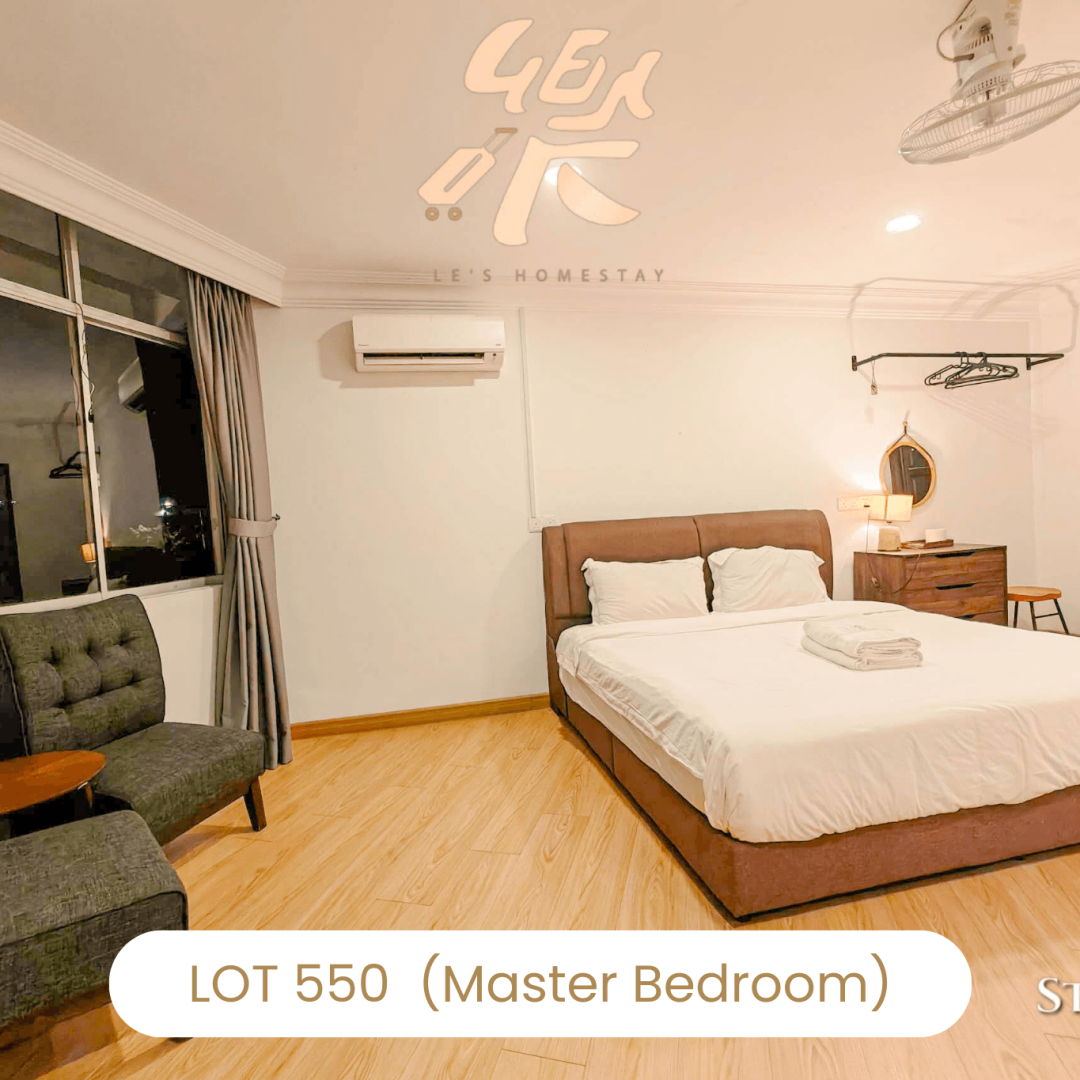 Master suite with sofa seating area at Le's Homestay Lot 550, a luxury Homestay Melaka Private Pool accommodation.