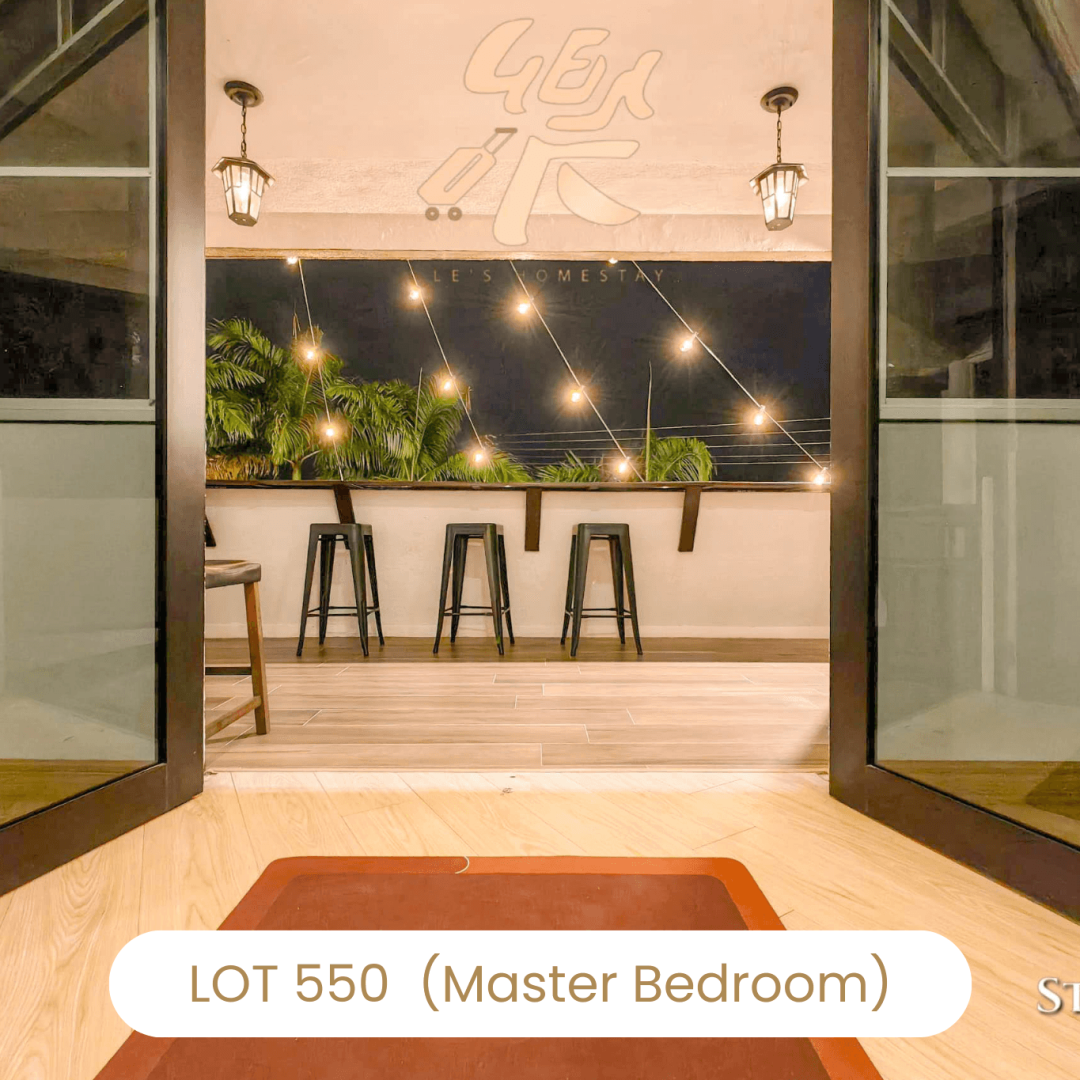 Balcony view with night lights from bedroom at Le's Homestay Lot 550, a relaxing Homestay Melaka Private Pool.