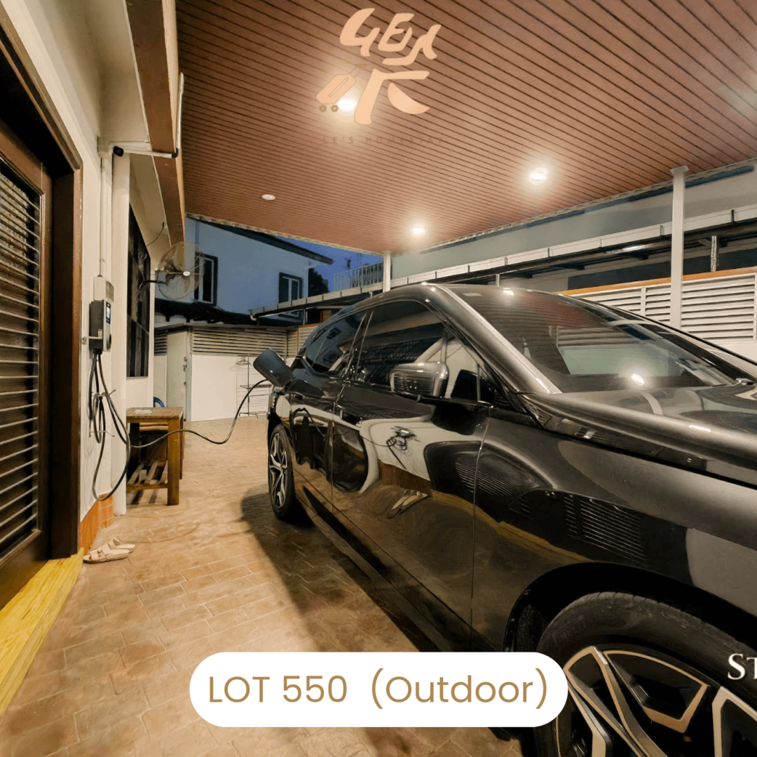 Spacious covered car porch parking area at Le's Homestay Lot 550, a convenient Homestay Melaka Private Pool facility.