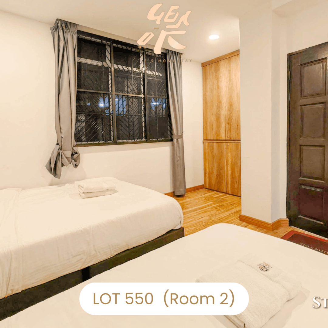 Comfortable bedroom interior with wooden wardrobe at Le's Homestay Lot 550, a clean Homestay Melaka Private Pool unit (Room 2).
