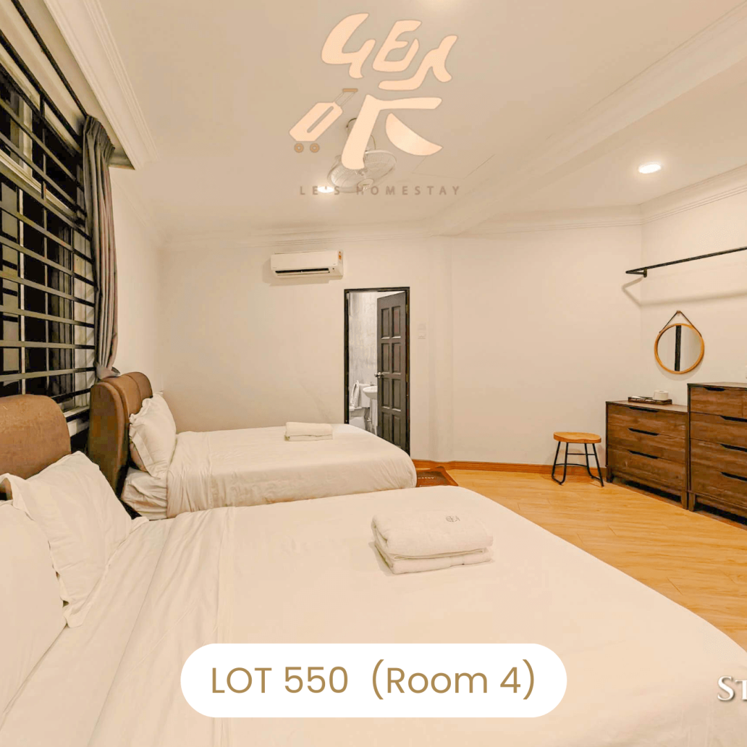 Bright and airy bedroom with wooden flooring at Le's Homestay Lot 550, a cozy Homestay Melaka Private Pool accommodation (Room 4).