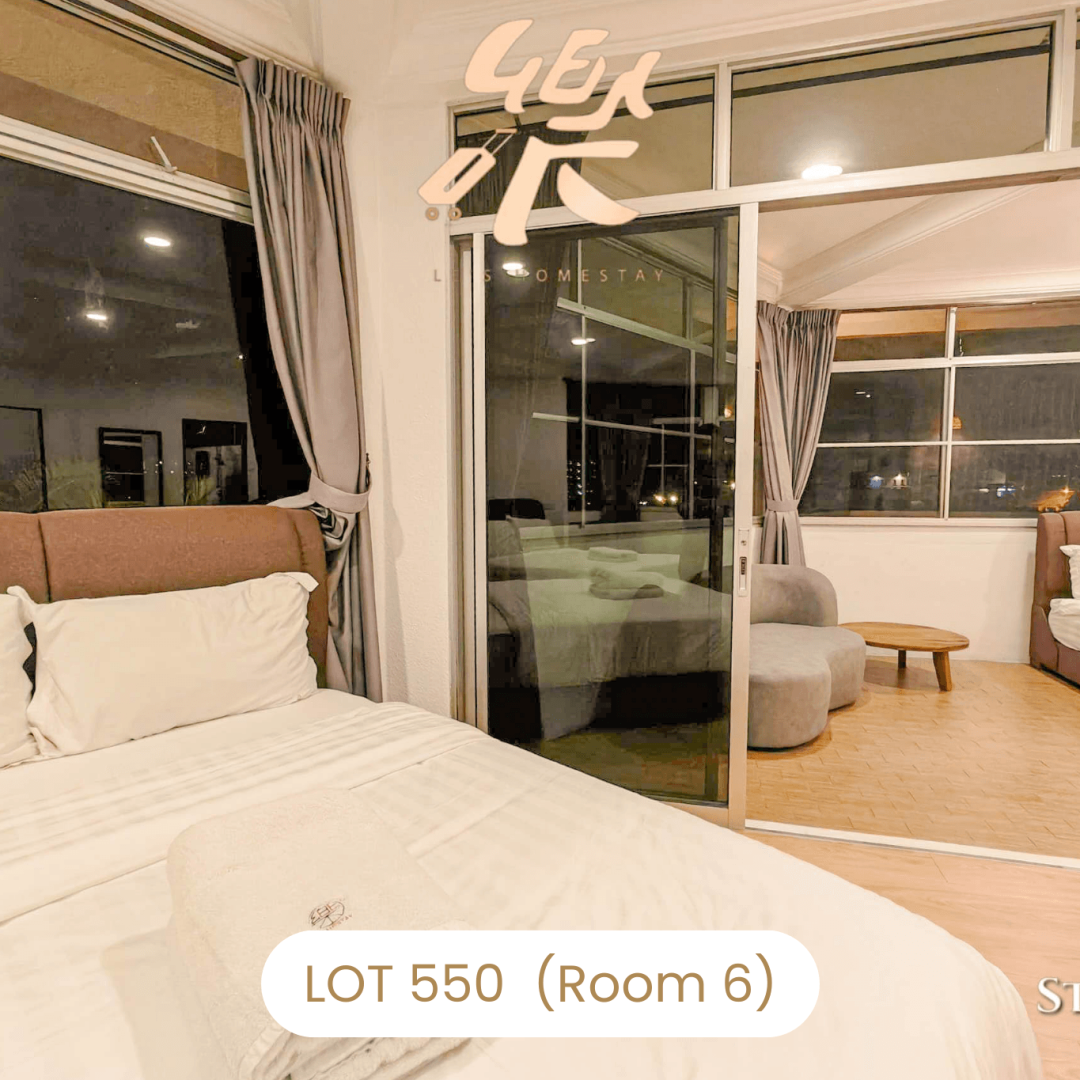 Bedroom suite with sliding glass doors opening to balcony at Le's Homestay Lot 550, a scenic Homestay Melaka Private Pool villa.