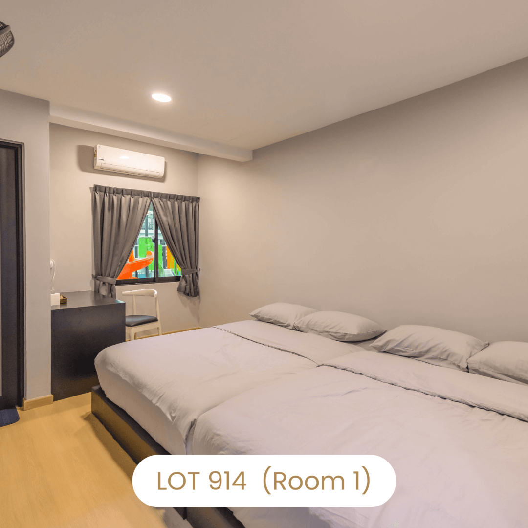Comfortable family bedroom setup with two queen beds at Le's Homestay Lot 914