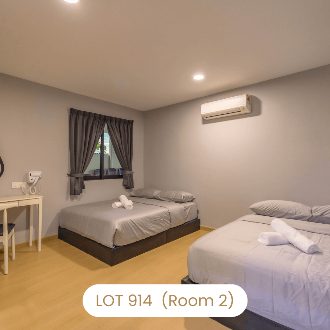 Comfortable bedroom setup with two queen beds and air conditioning at Le's Homestay Lot 914 (Room 2)
