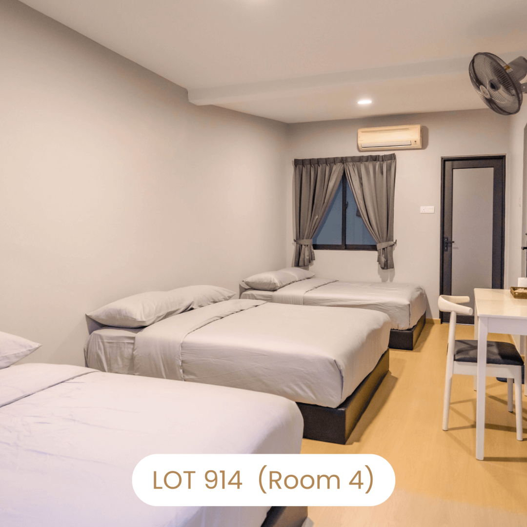 Cozy bedroom arrangement with queen beds and AC at Le's Homestay Lot 914 A'Famosa Homestay (Room 4)