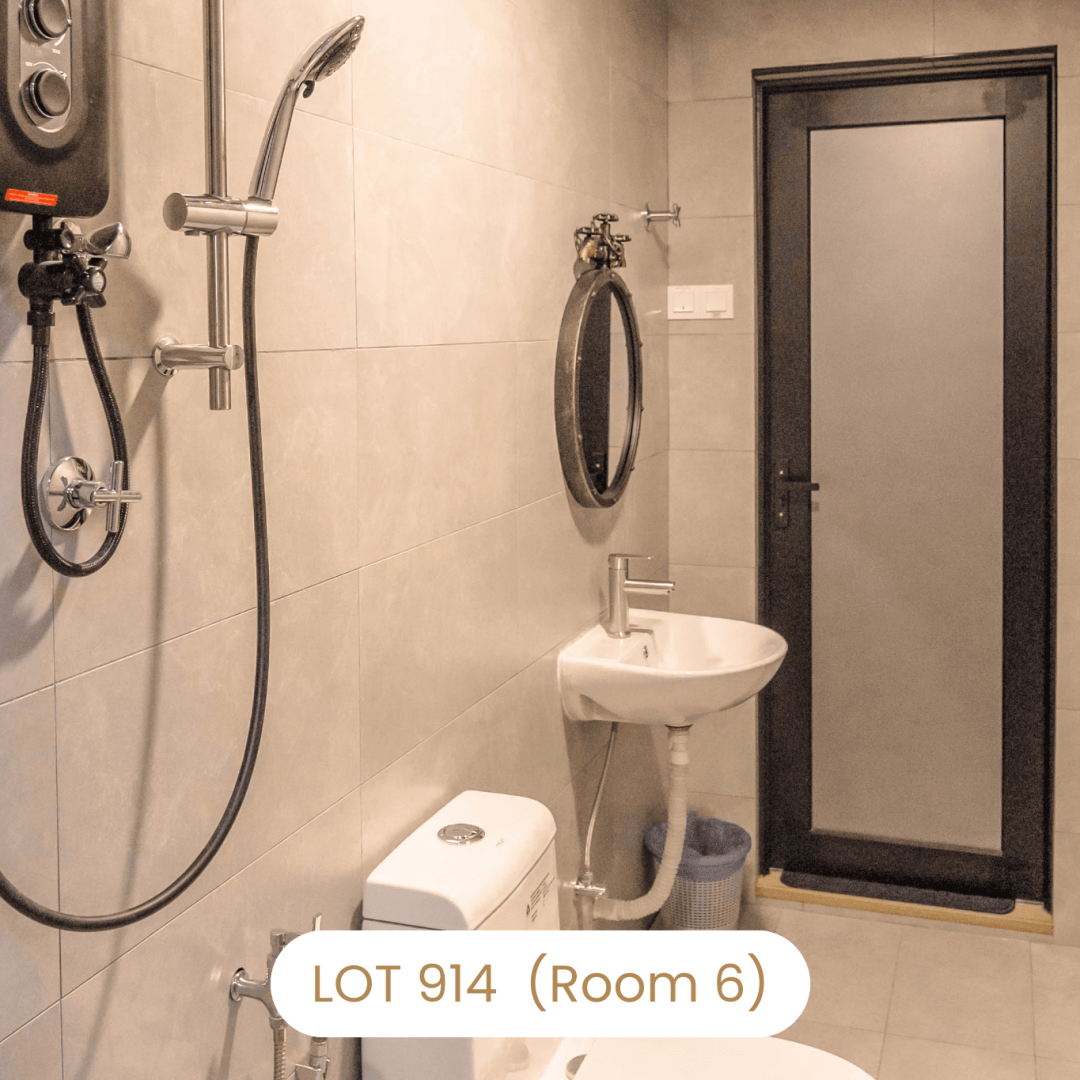 Ensuite bathroom with water heater shower and sink at Le's Homestay Lot 914 A'Famosa Homestay