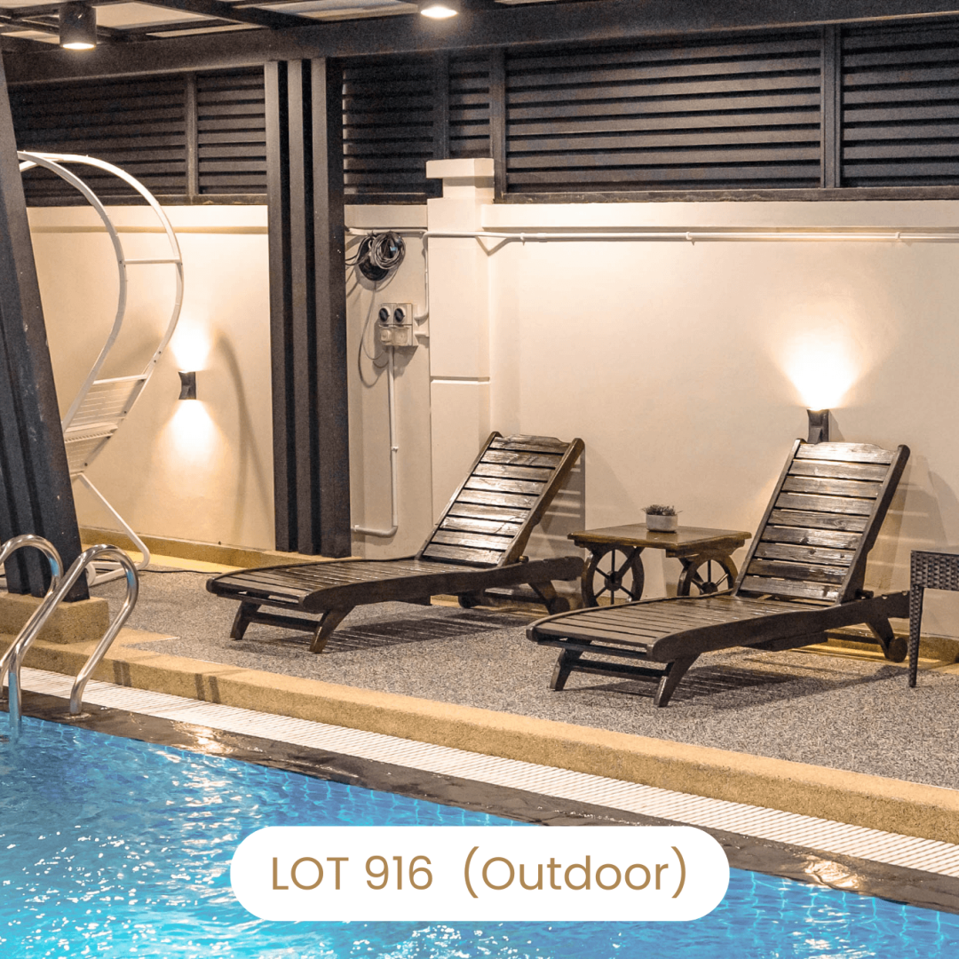 Poolside lounge chairs by the private swimming pool at Le's Homestay Lot 916