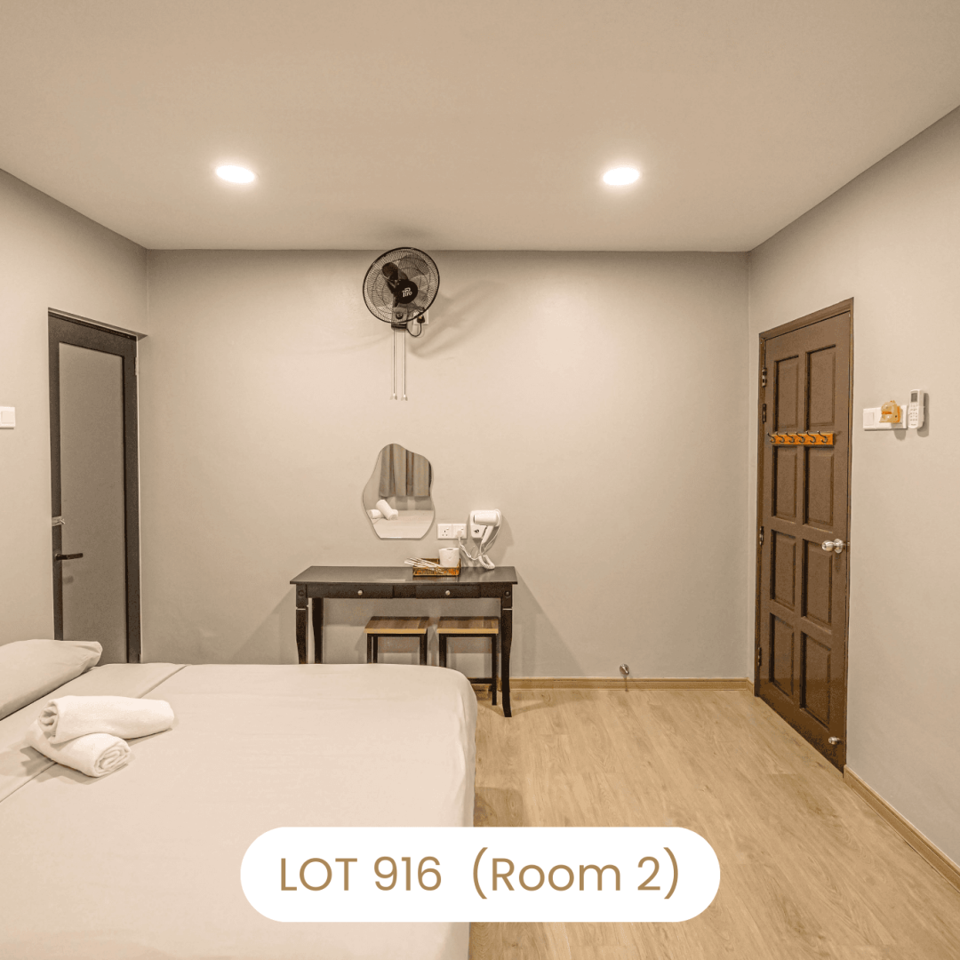 Bedroom vanity area and entrance door view in Room 2 at Le's Homestay Lot 916