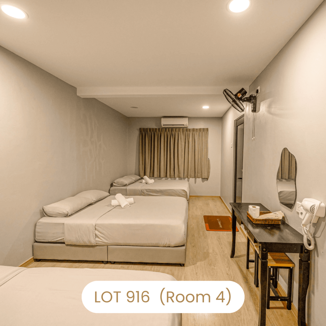 Comfortable family bedroom setup with multiple queen beds at Le's Homestay Lot 916 (Room 4)