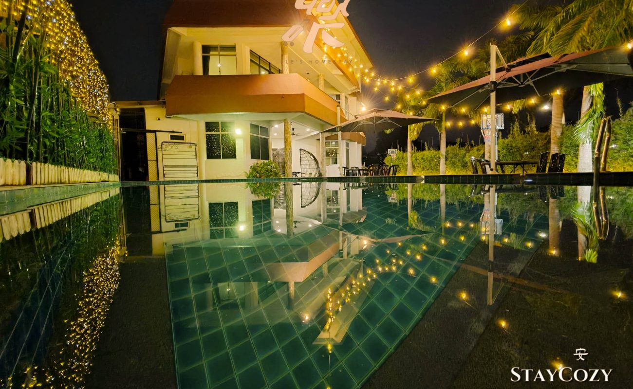 Large private swimming pool night view at Le's Homestay Lot 550, the perfect Homestay Melaka Private Pool accommodation.
