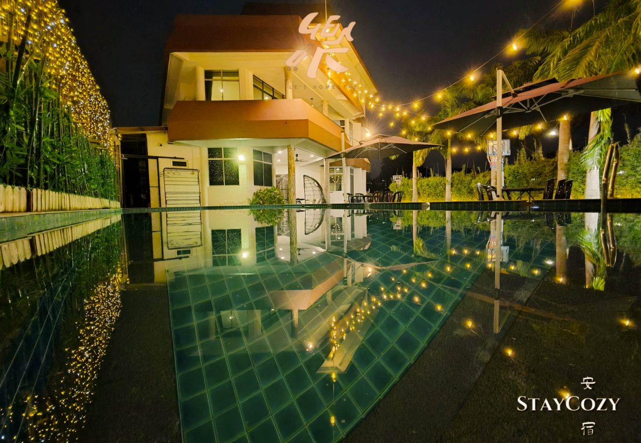 Large private swimming pool night view at Le's Homestay Lot 550, the perfect Homestay Melaka Private Pool accommodation.